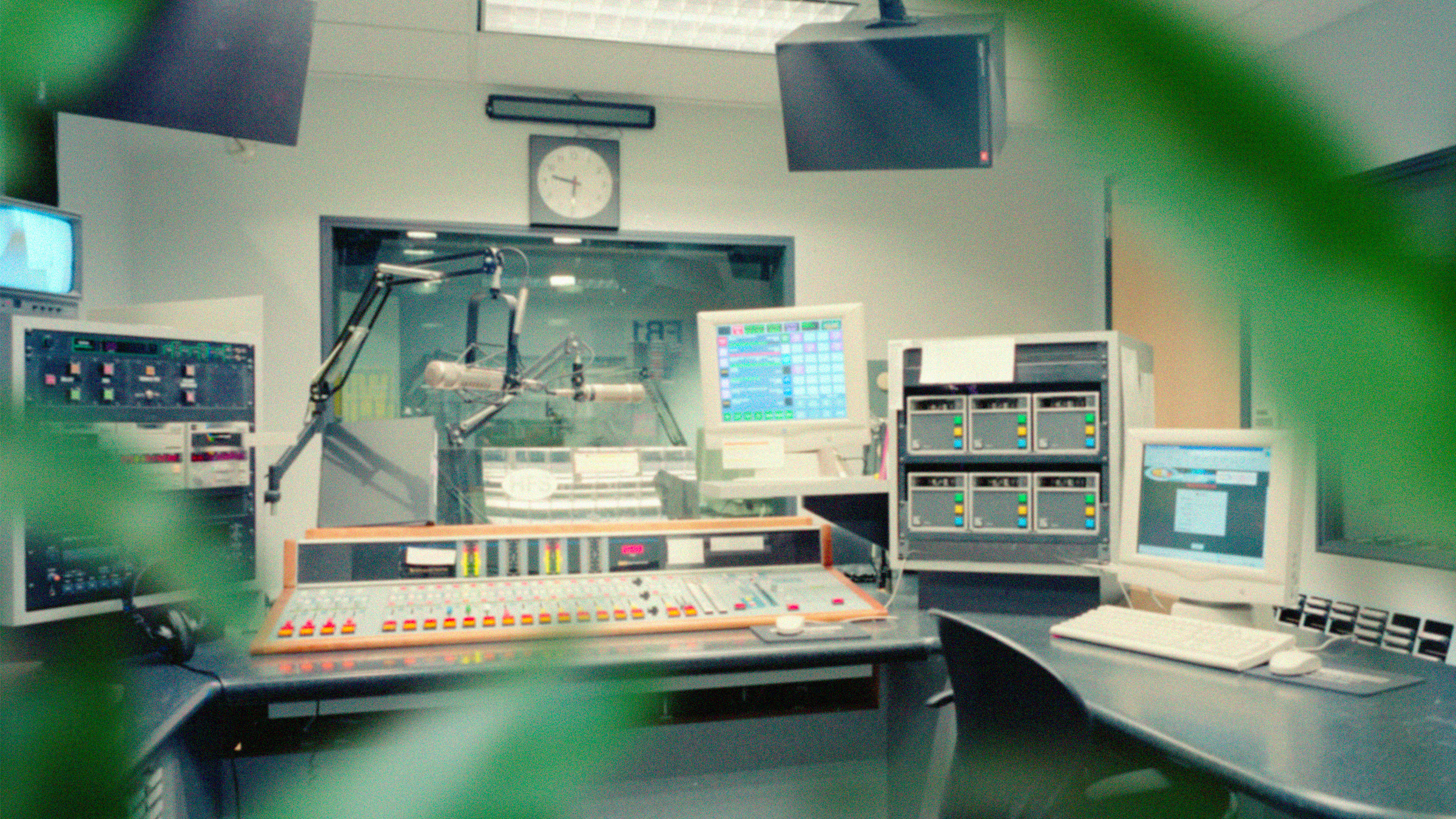The Natural Earth Field Recording Studio as seen from behind a ficus tree