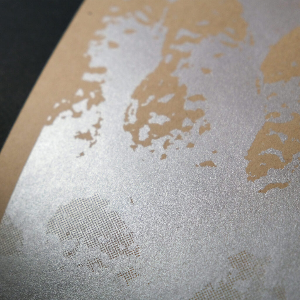 A white framed silkscreen print of a report cover titled US Peanut Industry shows silver ink on brown craft paper