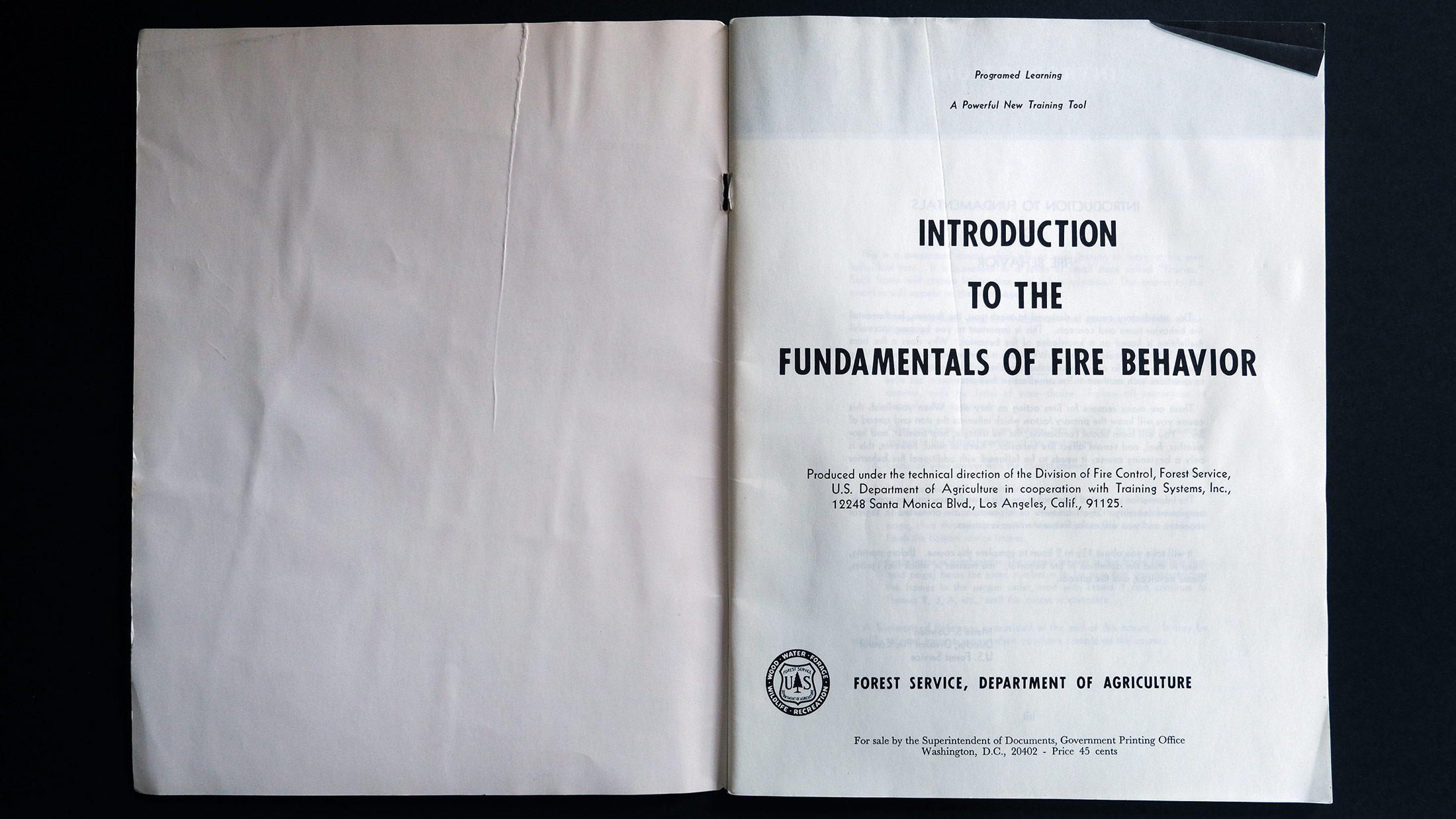 The weathered and wrinkled inside flap and cover in Introduction to the Fundamentals of Fire Behavior: Programed Learning, A Powerful New Training Tool by the US Forest Service (1960s)